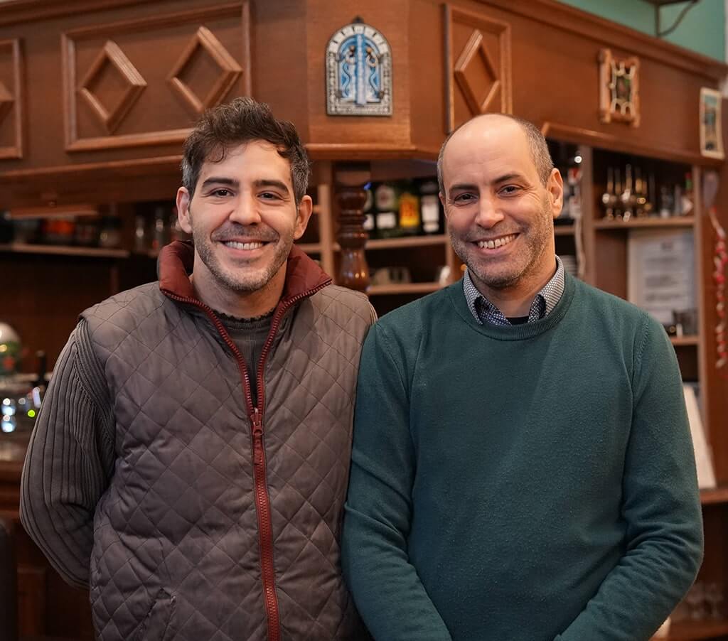 A portrait of Klifa and his brother Badi standing inside Le Jasmin