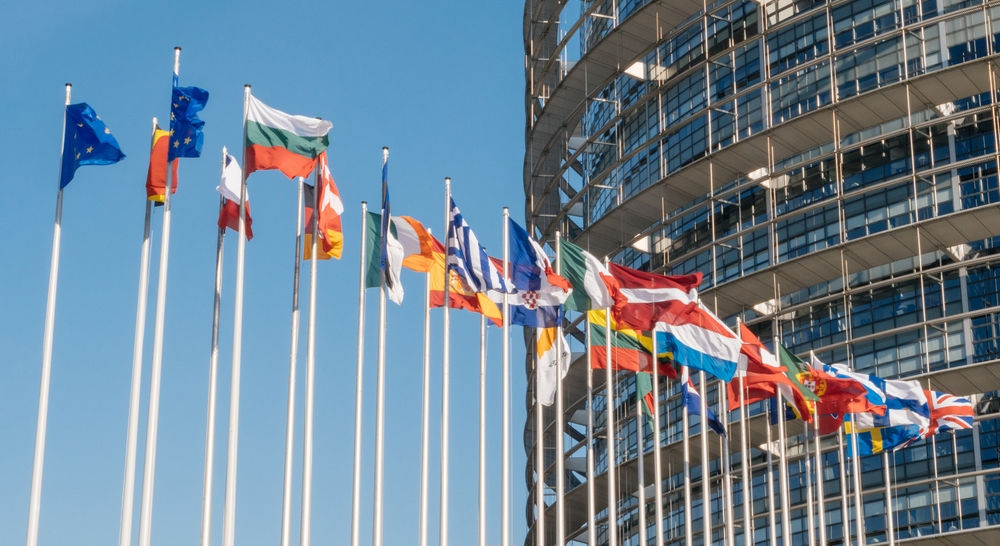 Several flags of different countires fly outside the parliament building in Strasbourg, France