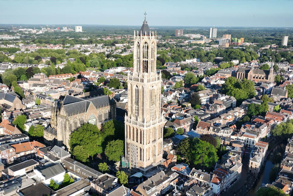 Drone view of the Dom Tower rising above the historic city center of Utrecht