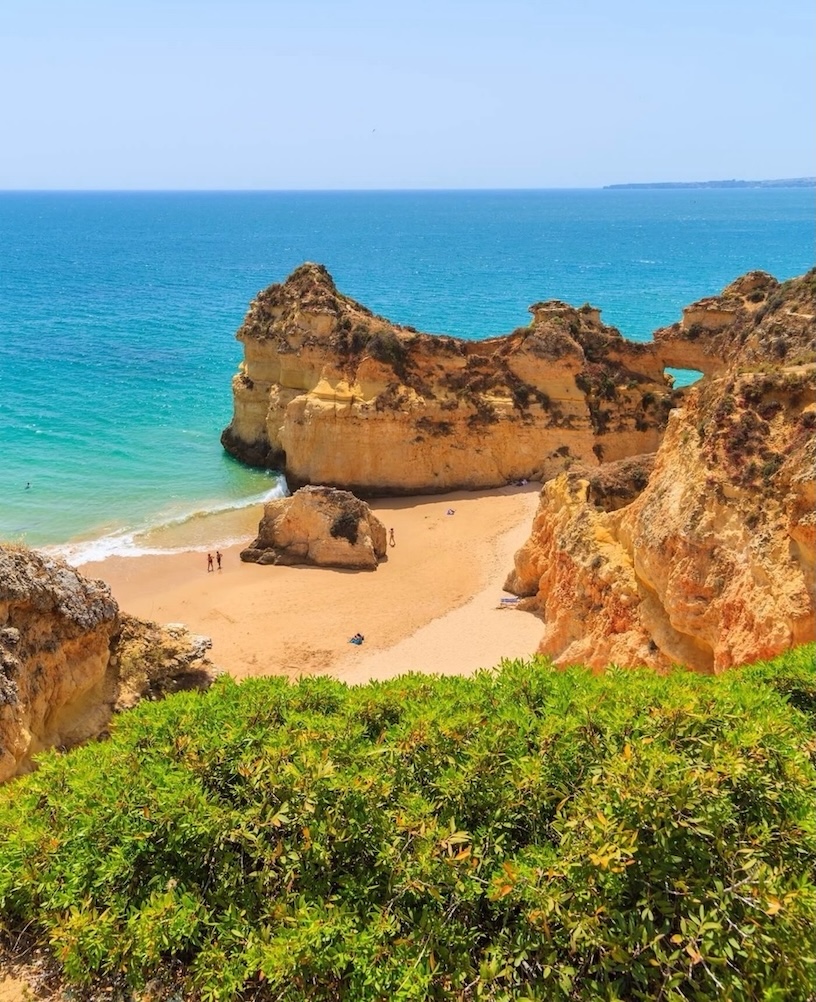 A sunny cove with blue, inviting ocean in Portugal