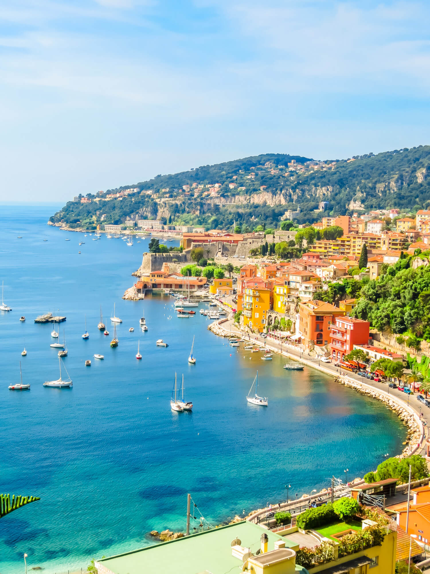 A view of Villefranche-sur-Mer's coastline, with boats in the sea