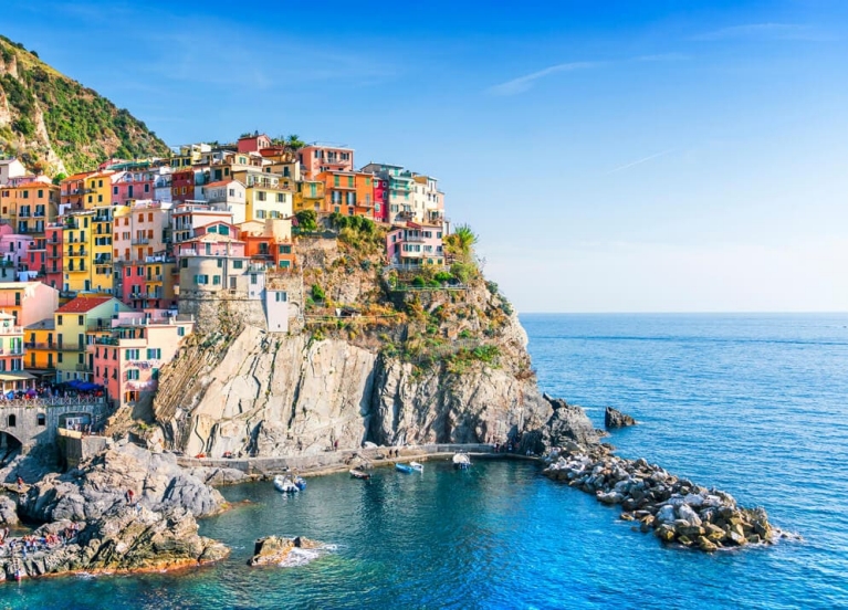 A colurful seaside town atop a hill