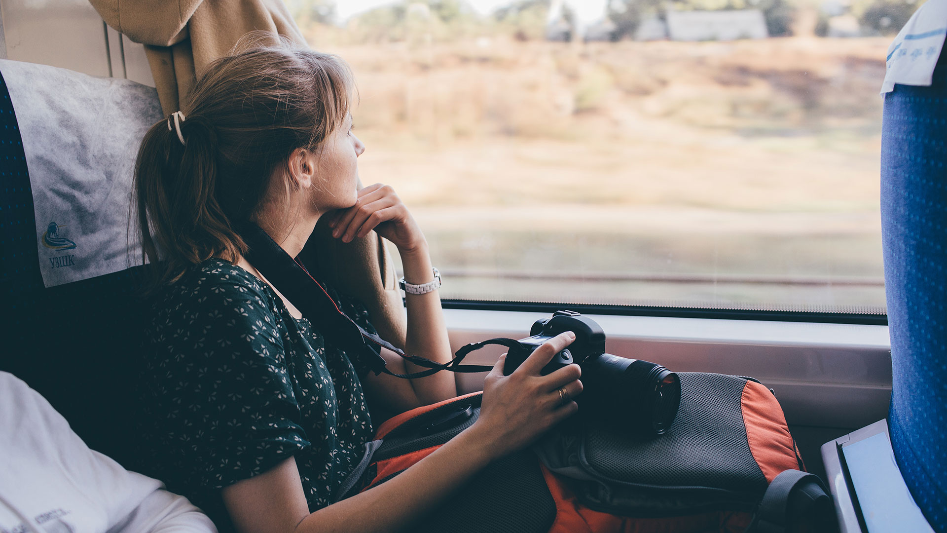 girl-on-train-looking-out-of-the-window