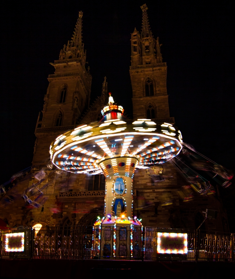 The Herbstmesse carnival rides illuminate the streets of Basel 