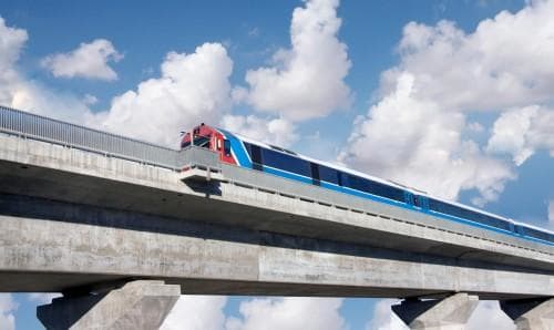 Regional train crossing a bridge in France