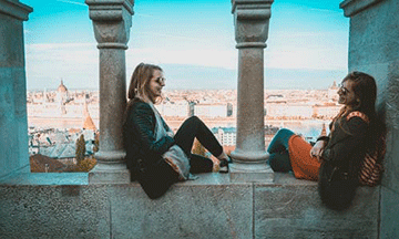 hungary-budapest-friends-sitting-in-fisherman-bastion
