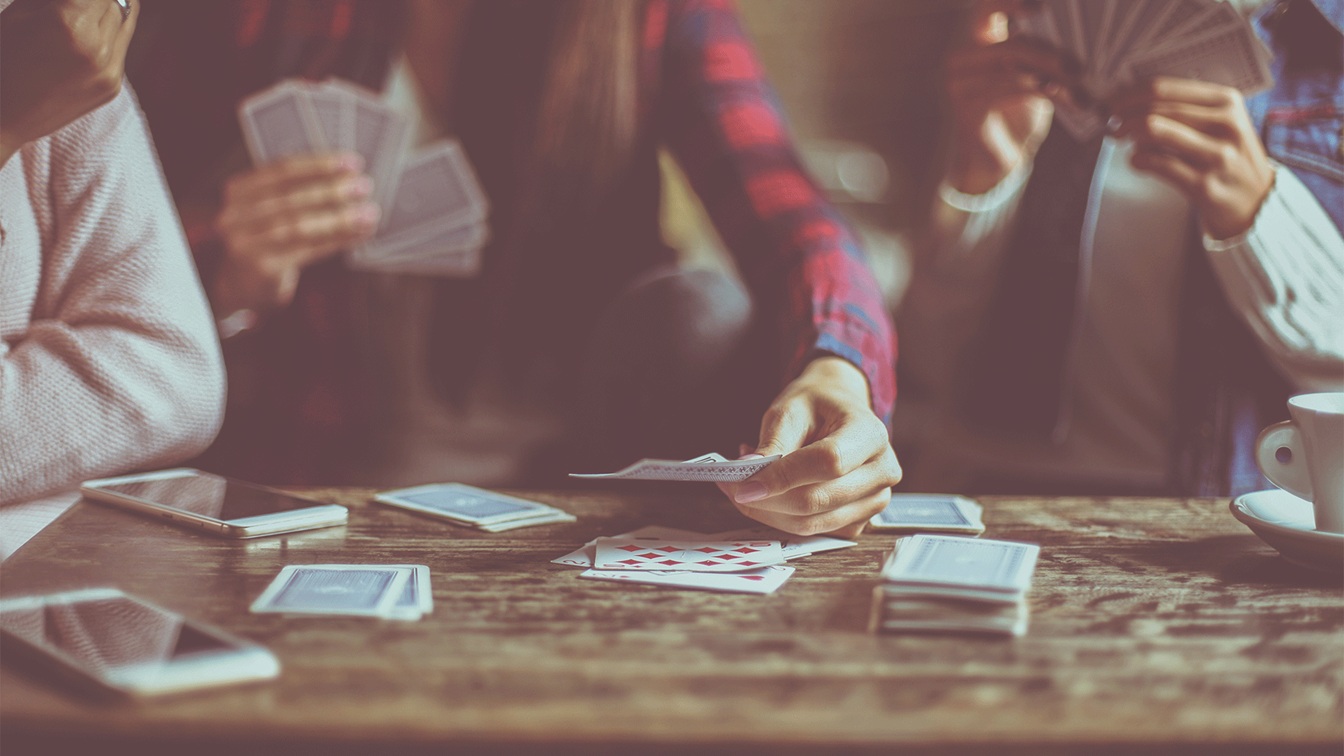 group-of-friends-playing-cards