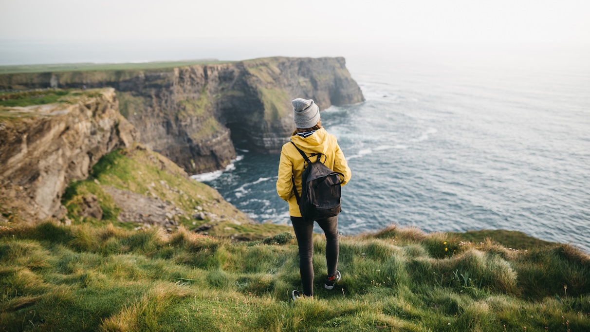 ireland-cliffs-moher-woman-backpack