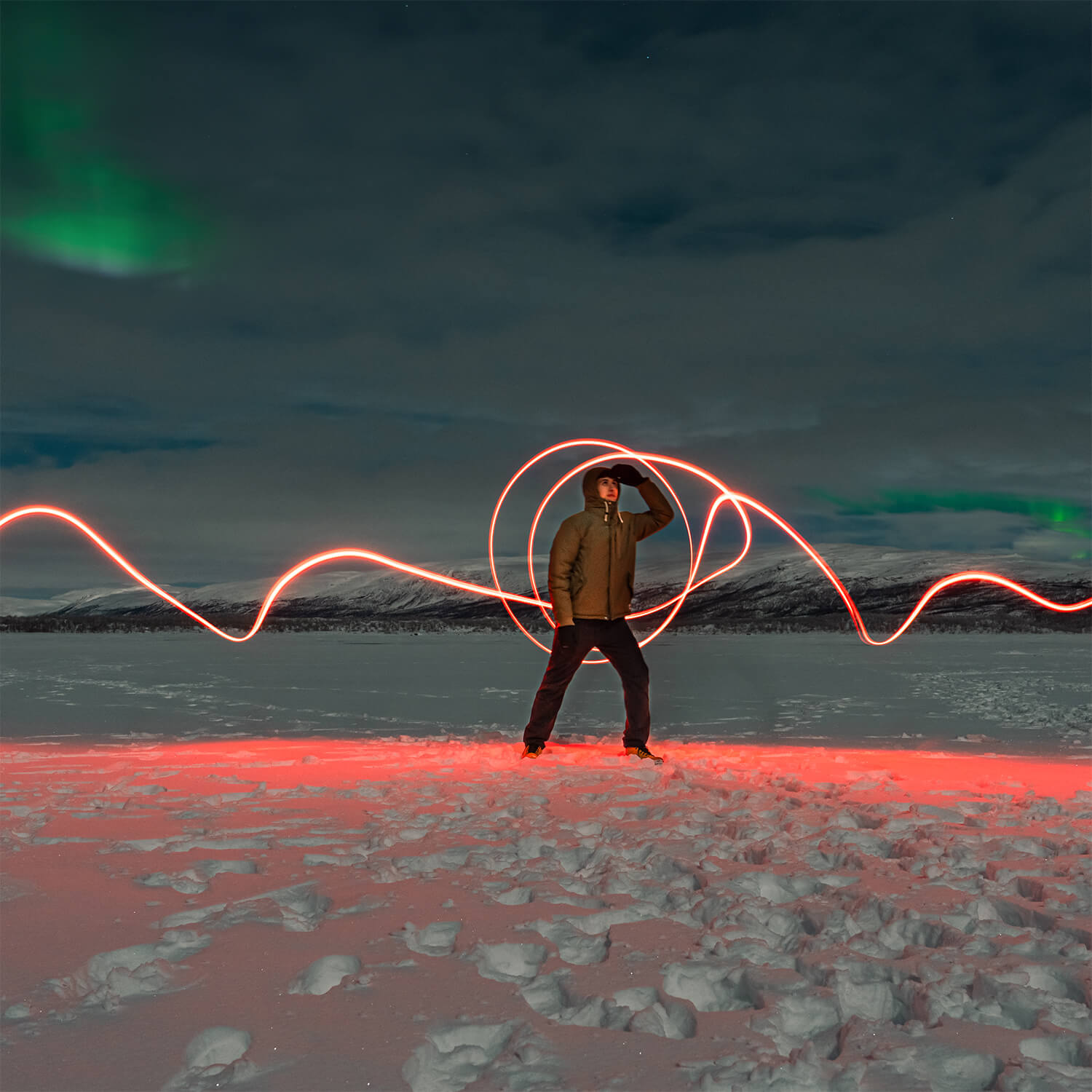Cristian light painting while waiting for the Northern Lights