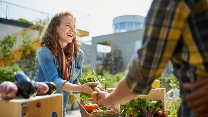 woman-selling-vegetables-on-farmers-market